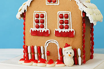 Decorated gingerbread house with spiced ginger and cinnamon flavors for Christmas