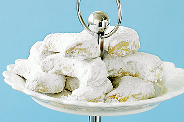 Golden Kourabiethes almond shortbread cookies dusted with icing sugar