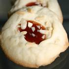 Whipped Shortbread Cookies with red and green maraschino cherries