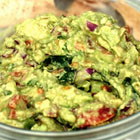 Creamy homemade guacamole dip with fresh cilantro and lime