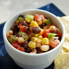 Spicy Bean Salsa with black beans, corn, and peppers in a white bowl