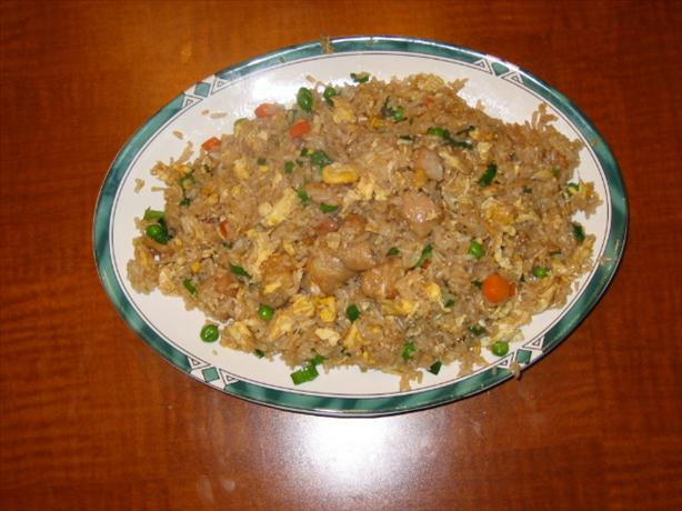 Benihana Japanese Fried Rice with peas, carrots, and egg in a white bowl