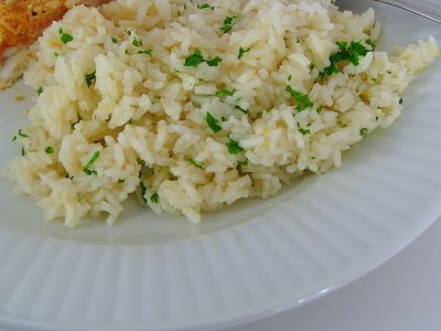 Lemon Rice Pilaf with butter and garlic in a white bowl