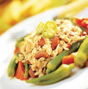 Vegetable Dirty Rice with sautéed peppers, onions, and garlic in butter