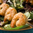 Marinated grilled shrimp with garlic and basil on a plate